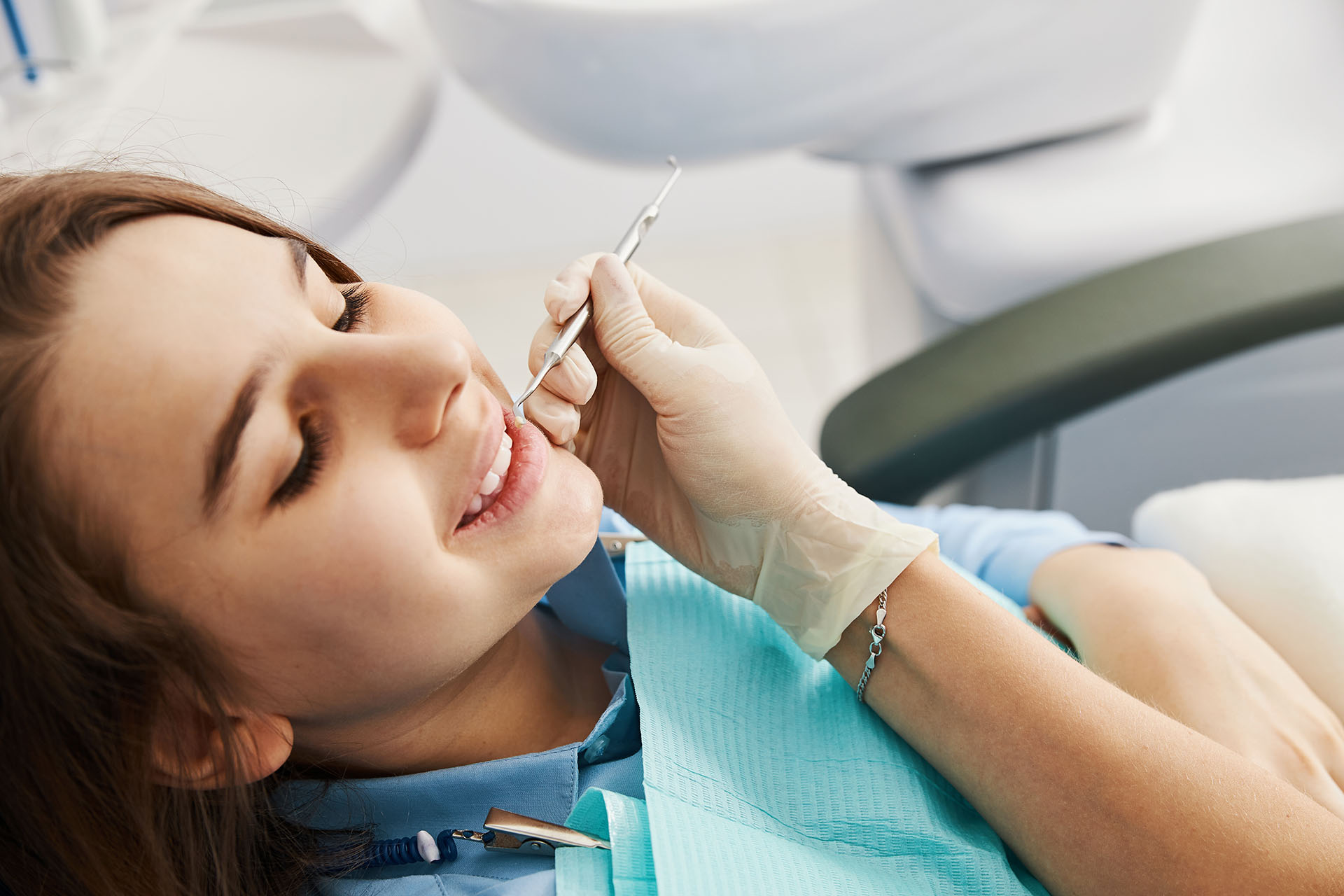 teenager getting teeth cleaning at dentist